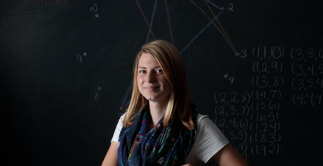 «Ӱҵ mathematics senior Rachel Liebrecht is pictured with some of her work.